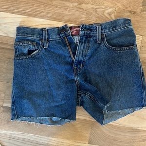 Mid waisted, dark wash, repurposed denim shorts
